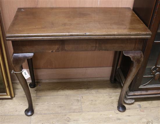 A Georgian mahogany folding rectangular card table W.84cm